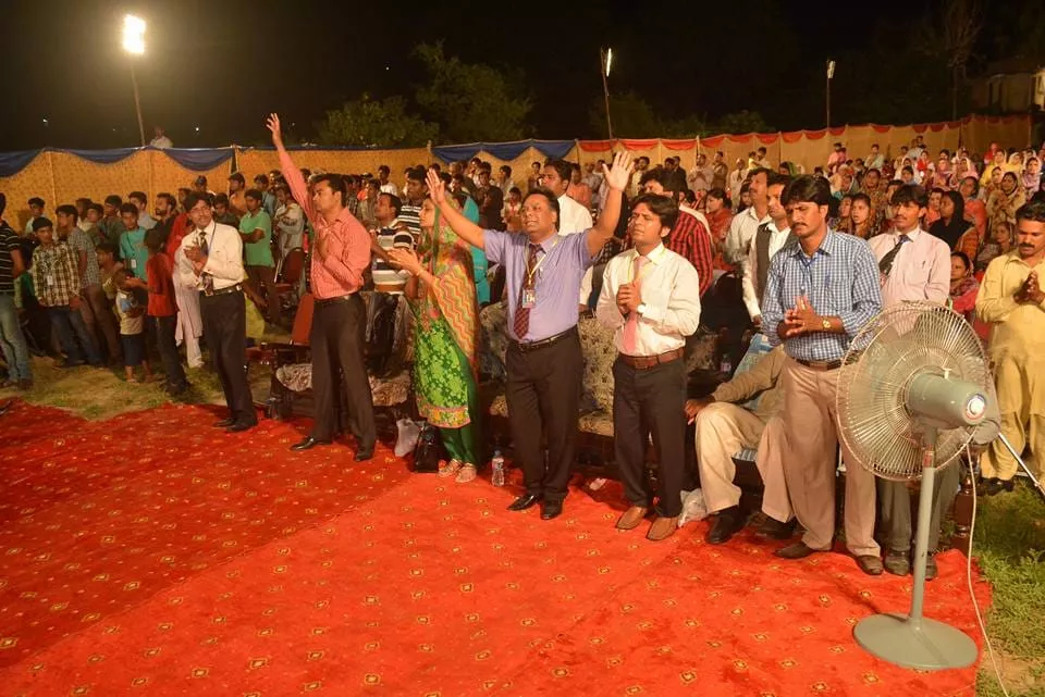 Worship session during revival meeting led by church leaders