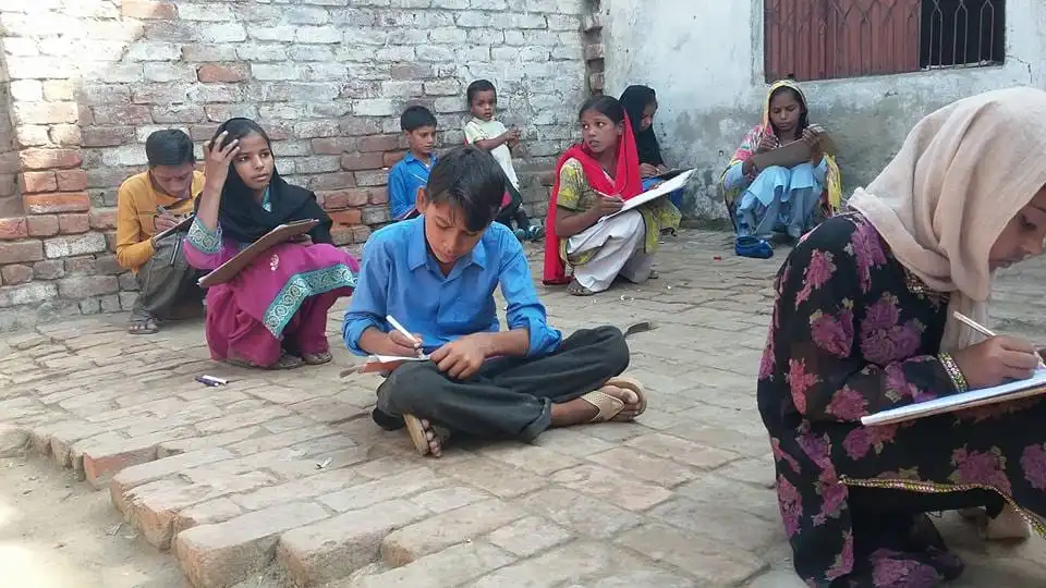 Distribution of school supplies to underprivileged children by ACC