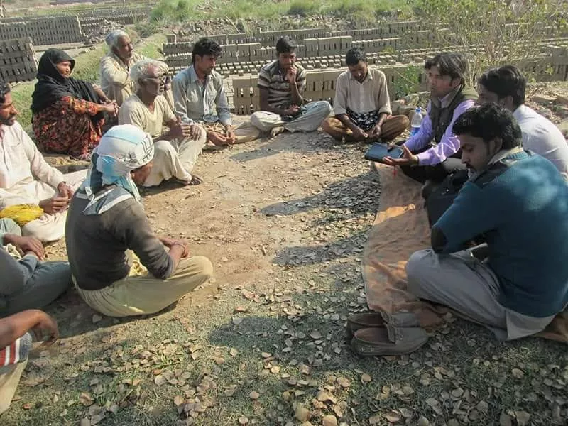 Poor brick kiln worker family receiving food and care support in Pakistan