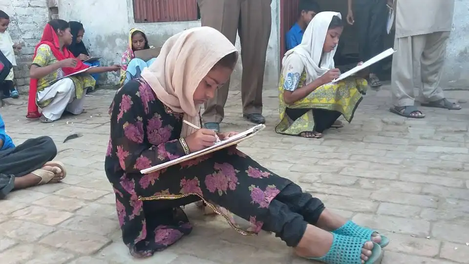 Children receiving education support through Apostolic Charismatic Church programs