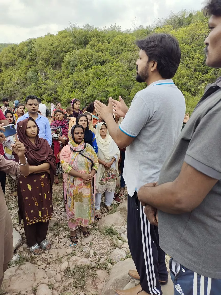 Church volunteers distributing monthly care packages to widows